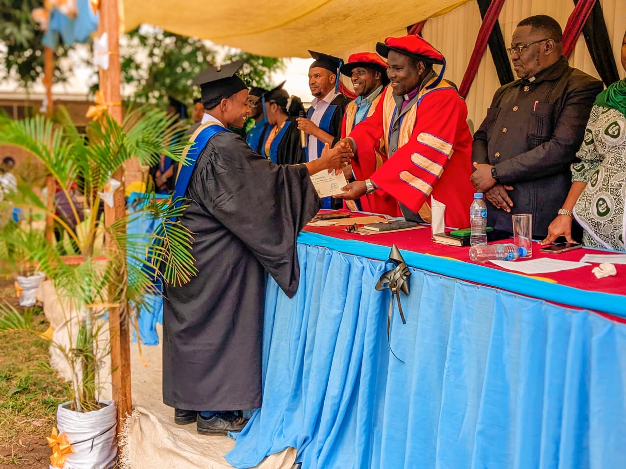 Graduates receiving certificates after completing their studies